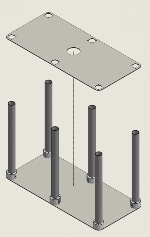 The Anchorage Top Plate held above the six standing tubes and lowered straight down over them.